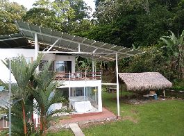 For sale, 2 houses, pool, organic banana plantation, and building land with several plots, near Cahuita